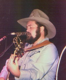 B. W. Stevenson playing the guitar